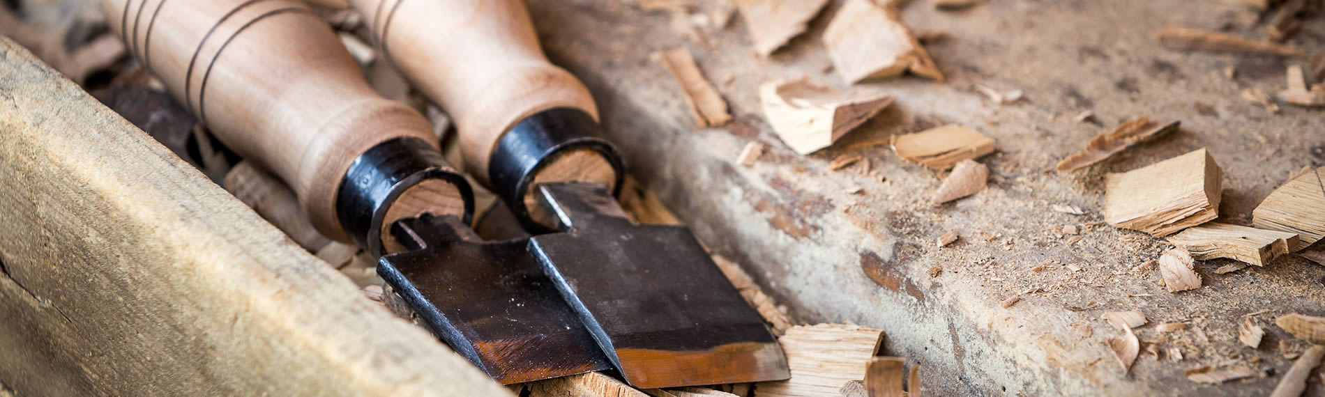 Chisels resting on a carpenter's workbench